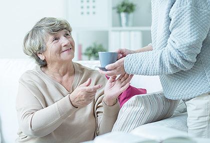 Lady being served tea