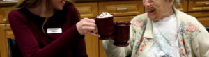 Photo of a volunteer spending time with a senior